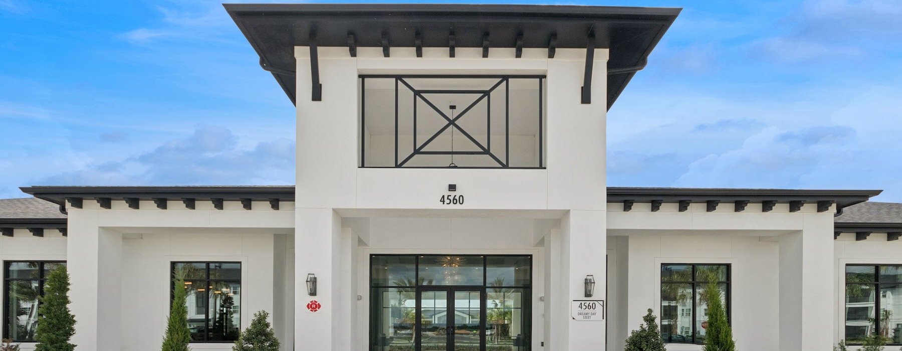 a white building with a large glass door