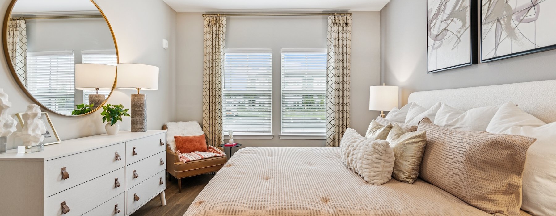 a bedroom with a large bed lamp and large window
