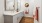 a bathroom with a sink and mirror and cabinets