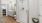 a bathroom with a glass shower and toilet and sink