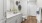 a bathroom with a toilet and sink and cabinets